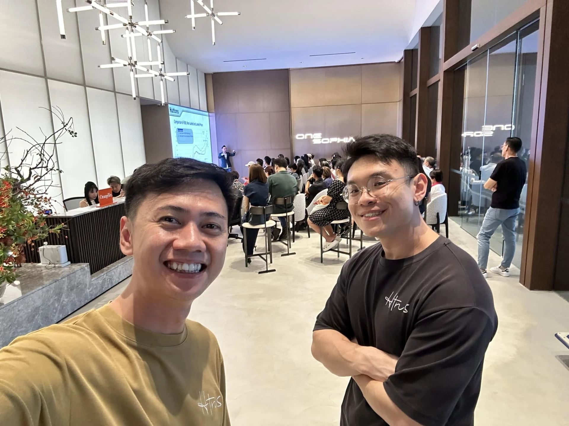 Two team members at a One Sophia sales gallery event